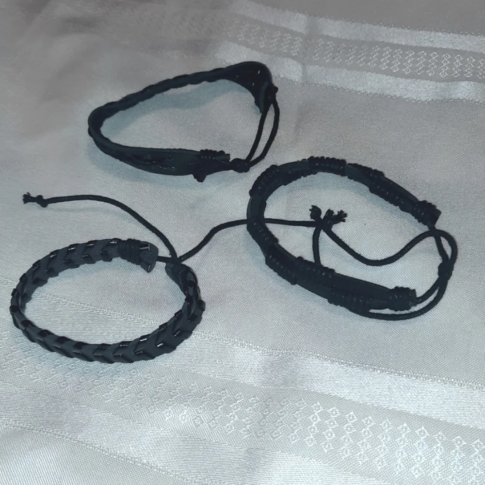 3 black bracelets